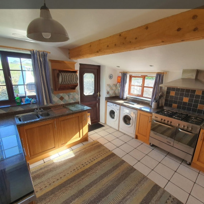 Kitchen in barn Owl cottage newquay, including tumble dryer