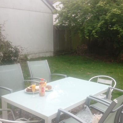 new alfresco table in sunny enclosed garden