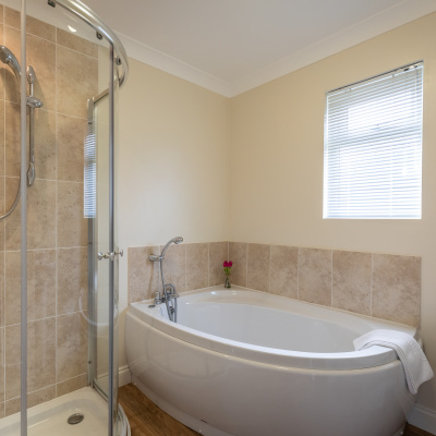 Family Bathroom with corner bath and separate shower cubicle