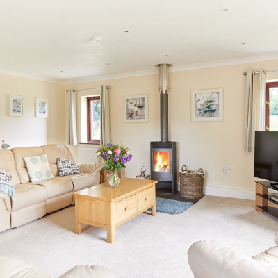 Lounge with wood burning stove. 